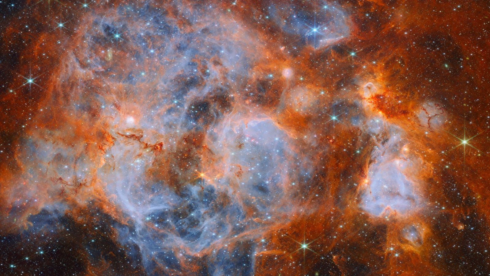 Webb revela berçário estelar turbulento a 161 mil anos-luz